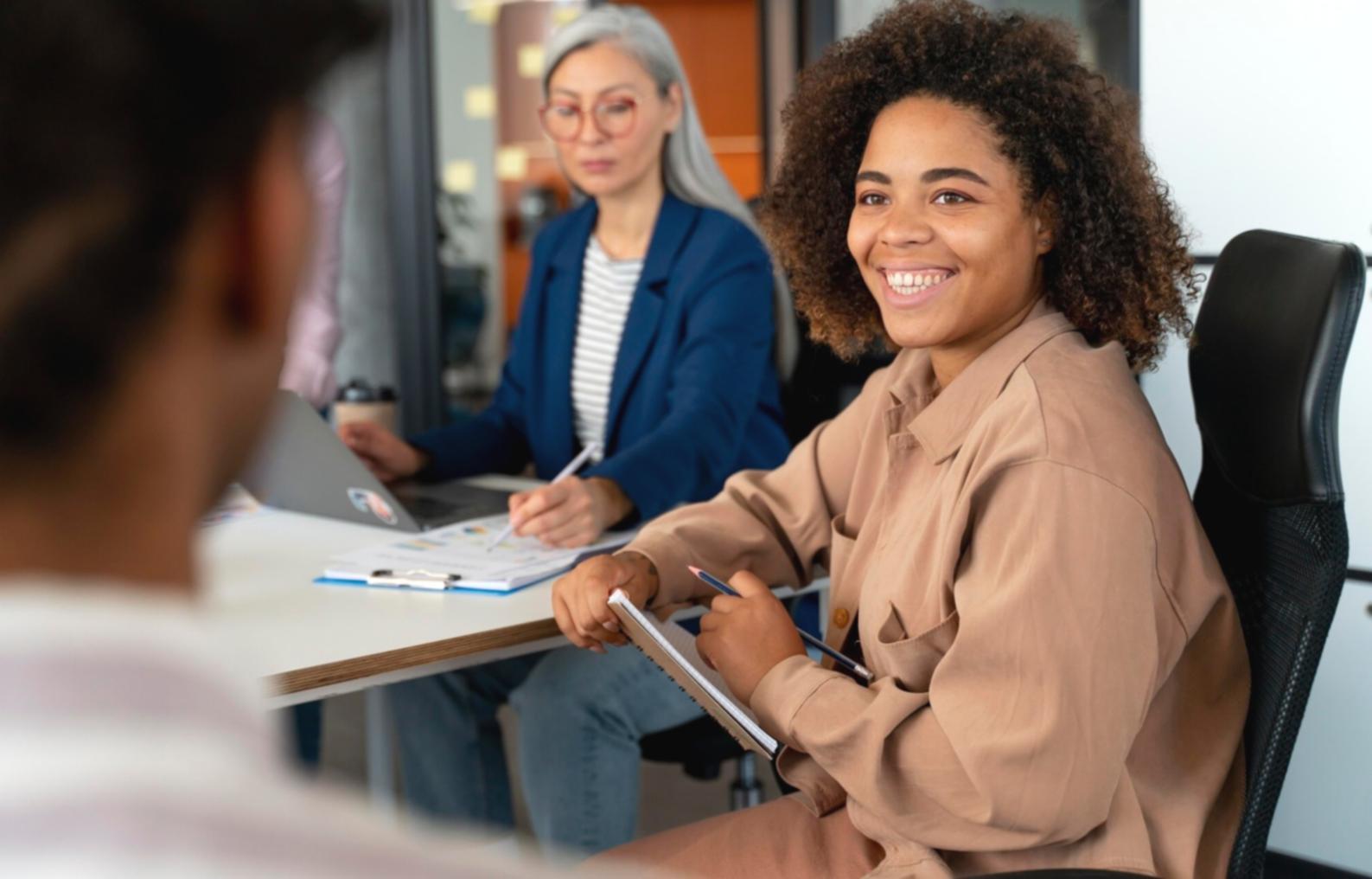 Team collaboration session analyzing financial scenarios on large display